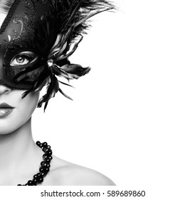 Beautiful Young Woman In Black Mysterious Venetian Mask. Black And White Fashion Photo