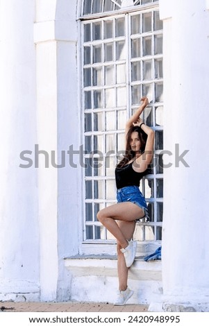 Similar – Brunette surfer woman with top and bikini holding surfboard