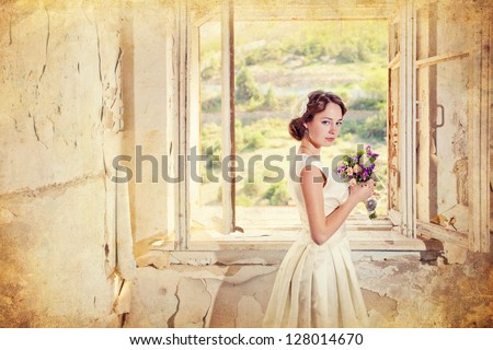 beautiful young woman with a bouquet of flowers is in the old room at the open window, photo of a woman with flowers in retro style