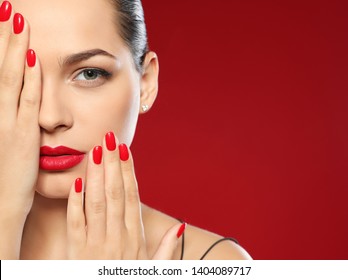 Beautiful young woman with bright manicure on color background, space for text. Nail polish trends