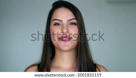 Beautiful young woman bursting laughing out loud. Pretty girl real life spontaneous smile and laugh