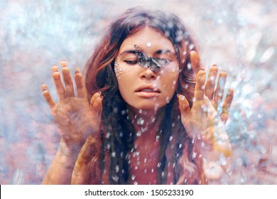 beautiful young woman with butterfly. conceptual. double exposure