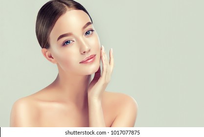 Beautiful young woman with clean fresh skin. Girl  beauty face care. Facial  treatment.