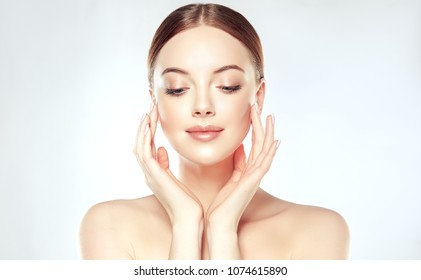 Beautiful Young Woman with Clean Fresh Skin. Face care  . Facial  treatment   . Cosmetology , beauty  and spa .   - Shutterstock ID 1074615890