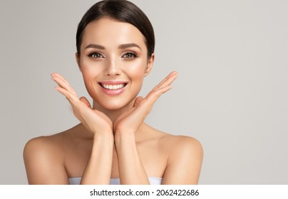 Beautiful young woman with clean fresh skin on face . Girl facial  treatment   . Cosmetology , beauty  and spa . - Shutterstock ID 2062422686