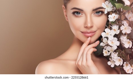 Beautiful young woman with clean fresh skin touching her face in flowers  . Girl facial  treatment   . Cosmetology , beauty  and spa . Female  model, care concept  - Shutterstock ID 2255128661