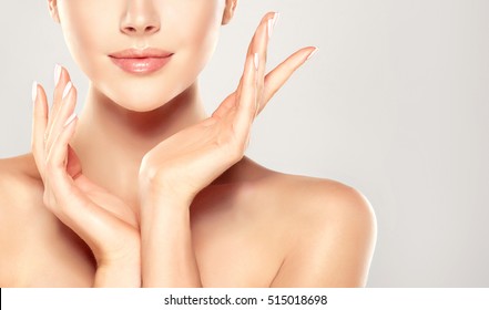 Beautiful Young Woman with Clean Fresh Skin  touch own face . Facial  treatment   . Cosmetology , beauty  and spa . - Shutterstock ID 515018698