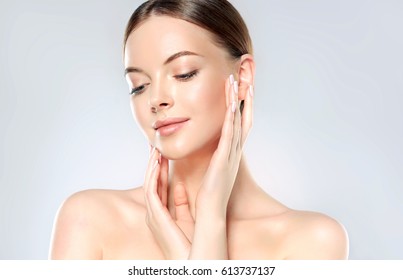 Beautiful Young Woman with Clean Fresh Skin look away  .Girl beauty face care. Facial  treatment   . Cosmetology , beauty  and spa . - Shutterstock ID 613737137