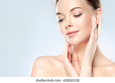 Beautiful Young Woman with Clean Fresh Skin look away  .Girl beauty face care. Facial  treatment   . Cosmetology , beauty  and spa . - Shutterstock ID 618265118