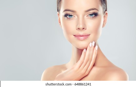 Beautiful Young Woman with Clean Fresh Skin . Facial  treatment   . Cosmetology , beauty  and spa . - Shutterstock ID 648861241