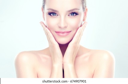 Beautiful Young Woman with Clean Fresh Skin . Facial  treatment   . Cosmetology , beauty  and spa . - Shutterstock ID 674907901