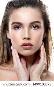 Beautiful Young Woman With Clean Perfect Skin And Wet Glossy Lips. Portrait Of Beauty Model With Natural Make Up, Lifted Brows  And Long Eyelashes.  Spa, Skincare And Wellness.