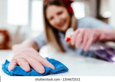 Beautiful Young Woman Cleaning House With Microfiber Rag. Housekeeping Concept.