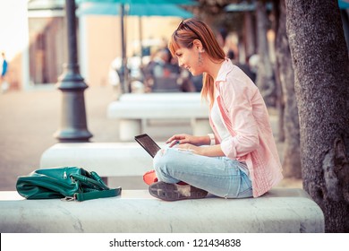 Beautiful Young Woman With Computer Outside