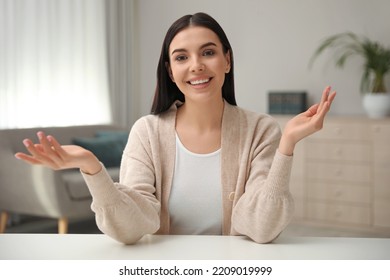 Beautiful Young Woman Conducting Webinar In Room, Camera View