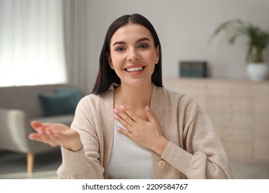 Beautiful Young Woman Conducting Webinar In Room, Camera View