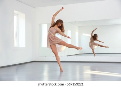 Beautiful Young Woman Dancing In Studio