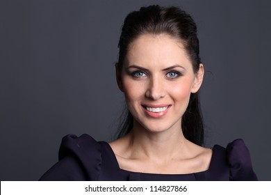 Beautiful Young Woman In Dark Background