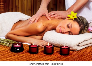 Beautiful Young Woman In A Day Spa Getting Massage. Relax.