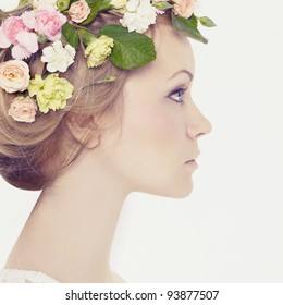 Beautiful Young Woman With Delicate Flowers In Their Hair