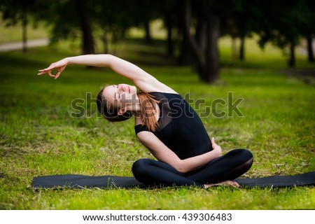 Similar – Young woman doing yoga in nature