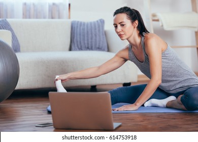 Beautiful Young Woman Doing Yoga At Home.