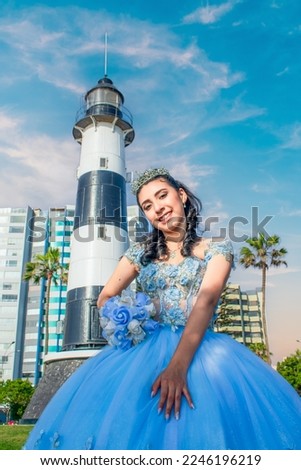 Beautiful young woman dressed in a princess costume in an urban landscape with a lighthouse and space for text.