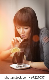 Beautiful Young Woman Drinking Gluhwein Or Mulled Wine.