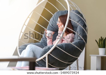 Similar – Mother hugging her baby in front of fireplace