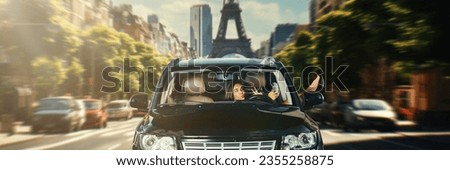 Beautiful young woman driving car on street in paris on daytime. Girl sitting in car and taking selfie with mobile phone. Concept of travel, human emotions, lifestyle, vacation, social media, ad