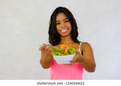 Beautiful young woman eating salad. care of the body and health. Lifestyle - Shutterstock ID 1146164621