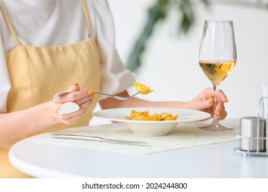 Beautiful Young Woman Eating Tasty Ravioli In Cafe, Closeup