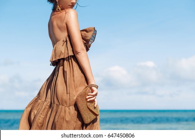 Beautiful Young Woman In Elegant Dress On The Beach