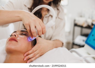 Beautiful young woman enjoying a hydrafacial treatment at the beauty salon. - Shutterstock ID 2199524311