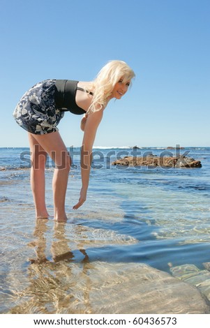 beautiful young woman enjoying summer vacation at the beach