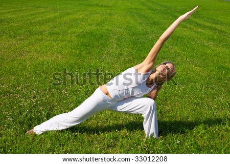 Similar – Young woman doing yoga in nature