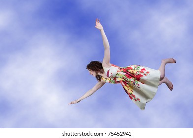 A Beautiful Young Woman Falling Through The Sky