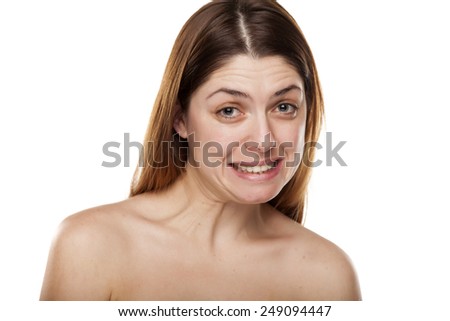 Beautiful young woman with a false smile