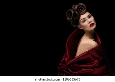 Beautiful Young Woman With Fancy Hairdo And Red Lips