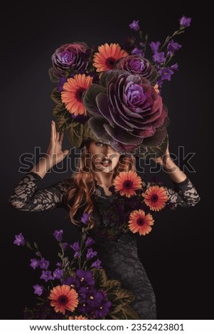 A beautiful young woman, fashion portrait with flowers surrounding her.