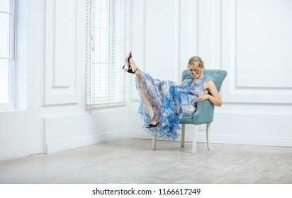 Beautiful Young Woman In Fashionable Dress Having Fun Indoors