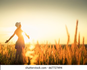 Beautiful Young Woman In A Field.