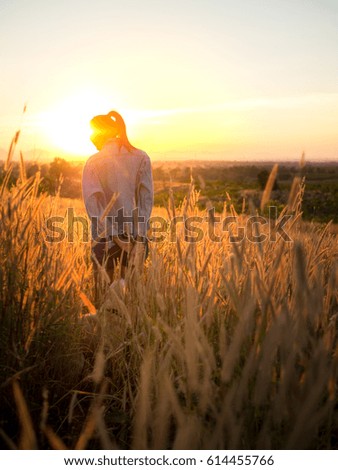 Similar – Image, Stock Photo Young woman looking at the sunset.