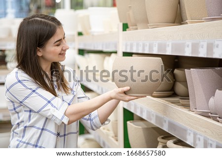 Similar – Beautiful ceramist owner looking to the camera while smiling