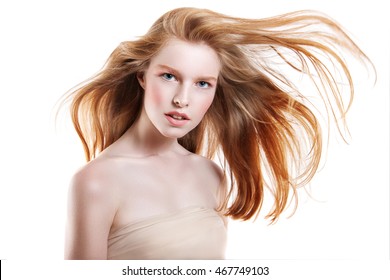 Beautiful Young Woman With Flying Hair. Red Hair Flying In The Wind.