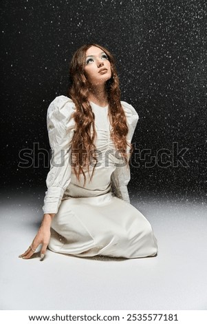 Image, Stock Photo Young woman gazing upwards in urban setting