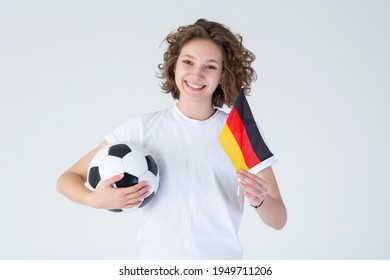 Beautiful young woman with Germany flag and soccer ball. German women's football. - Powered by Shutterstock