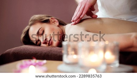 Beautiful Young Woman Getting Back Massage At Spa
