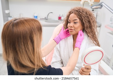 Beautiful young woman getting a consultation from a beautician - Shutterstock ID 2184657561