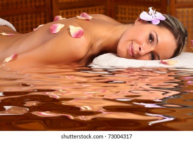 Beautiful young woman getting spa massage. Relax
